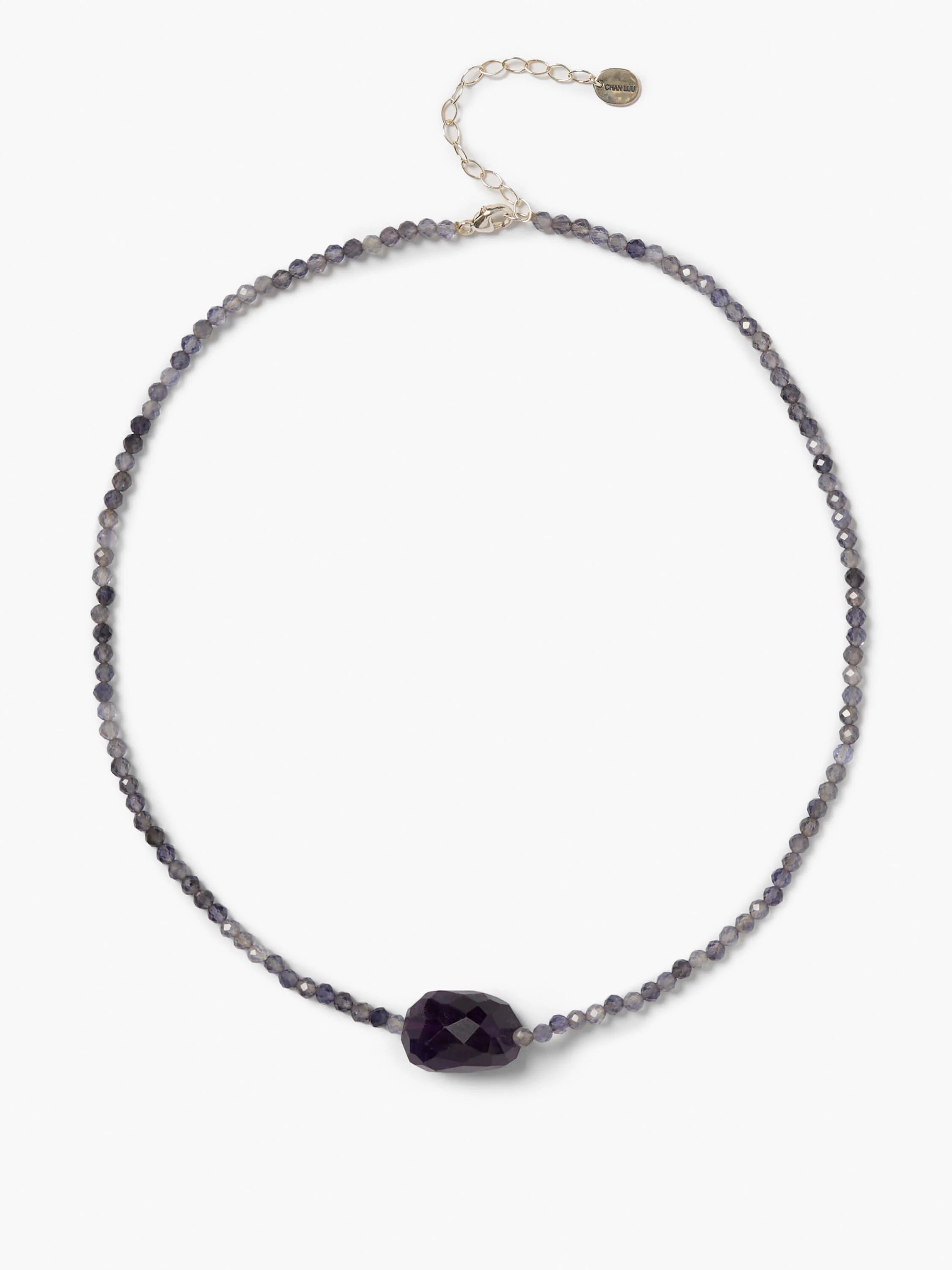 Iolite beaded necklace with small faceted purplish-gray beads, a larger dark purple center bead, and a silver clasp.