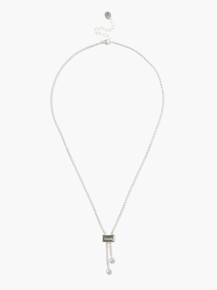 Silver chain necklace with a dark greenish-gray rectangular labradorite stone and two small white pearls.