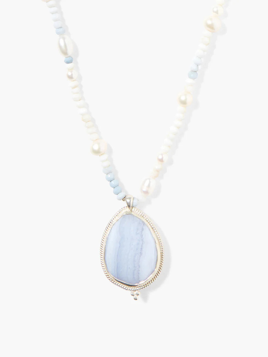 Blue lace agate pendant necklace; light blue stone, silver setting, white and light blue beads.