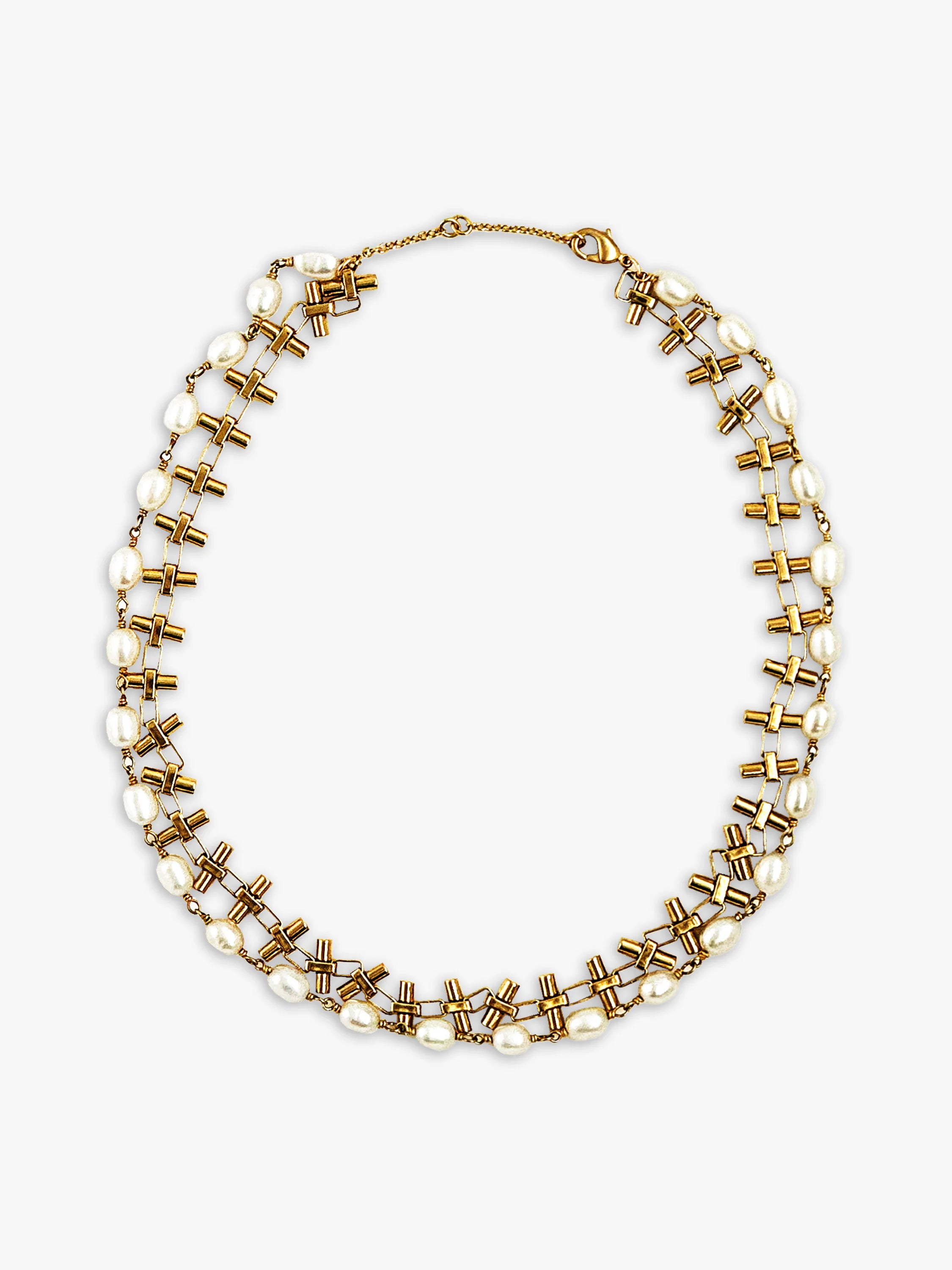 Double-strand gold necklace with bell-shaped links and wire-wrapped irregular cream pearls.