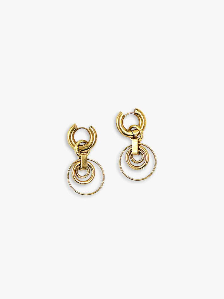 Gold-toned drop earrings. Each features a thick hoop and three dangling, interconnected rings decreasing in size.