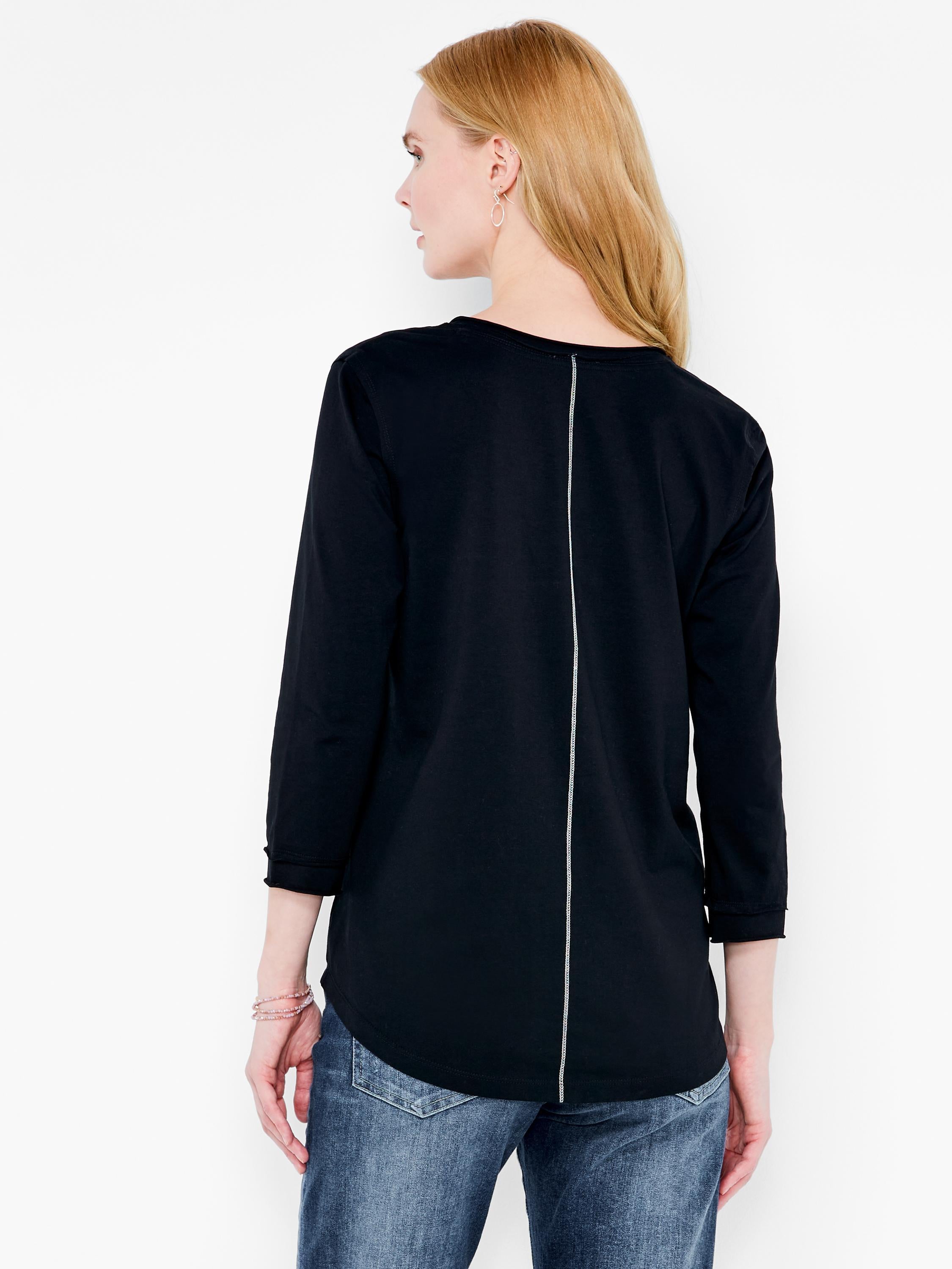 Relaxed black top featuring three quarter sleeves, a curved hem, and a white vertical stripe down the back.