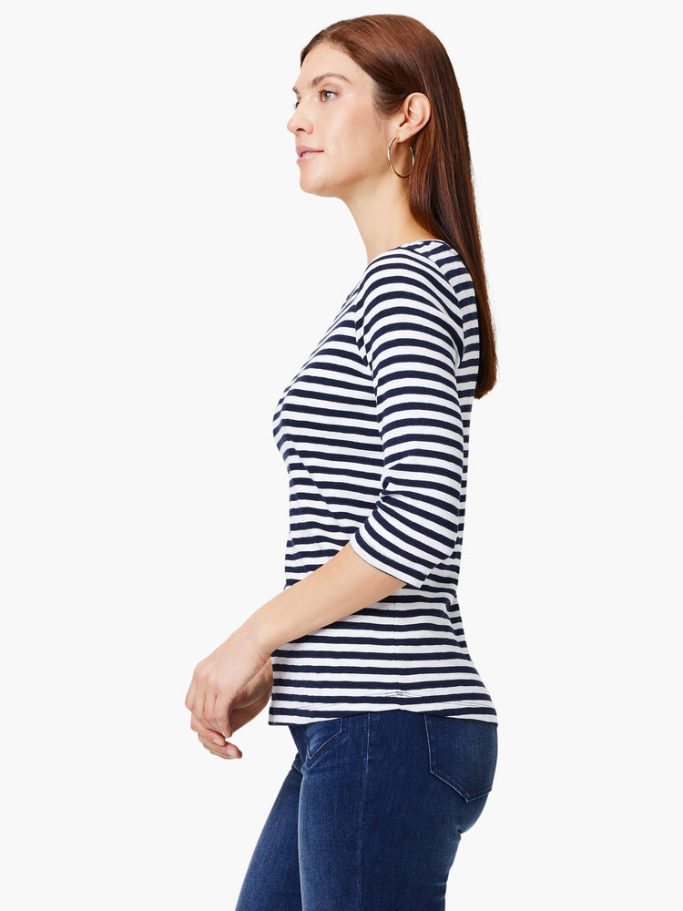 White and navy horizontal striped boat neck tee with 3/4 sleeves.