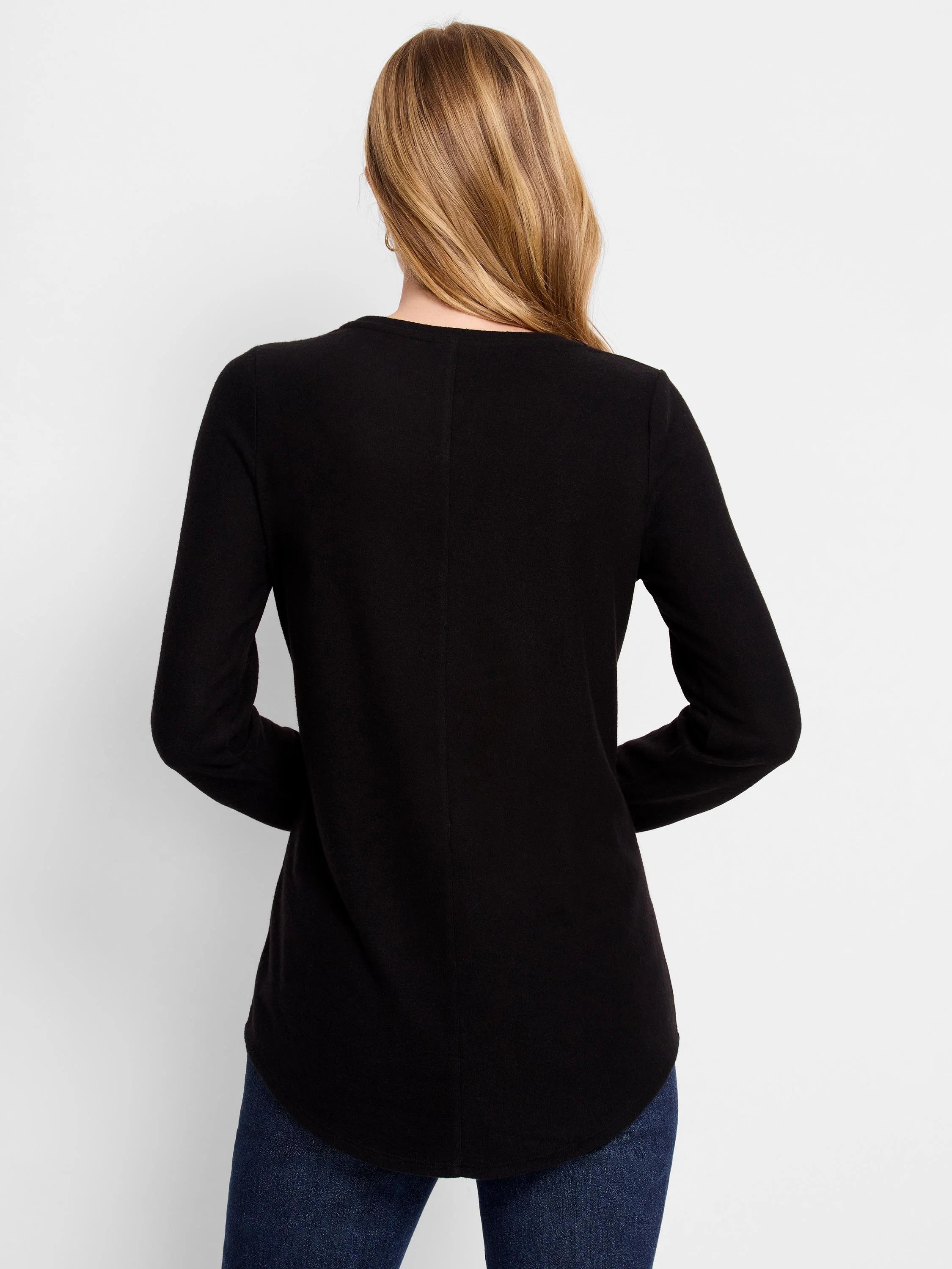 Black long-sleeve shirt with curved hemline. Shown from the back.