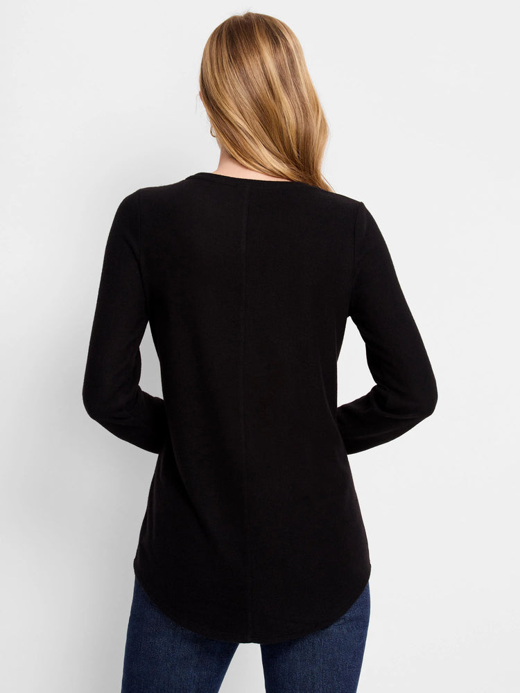Black long-sleeve shirt with curved hemline. Shown from the back.