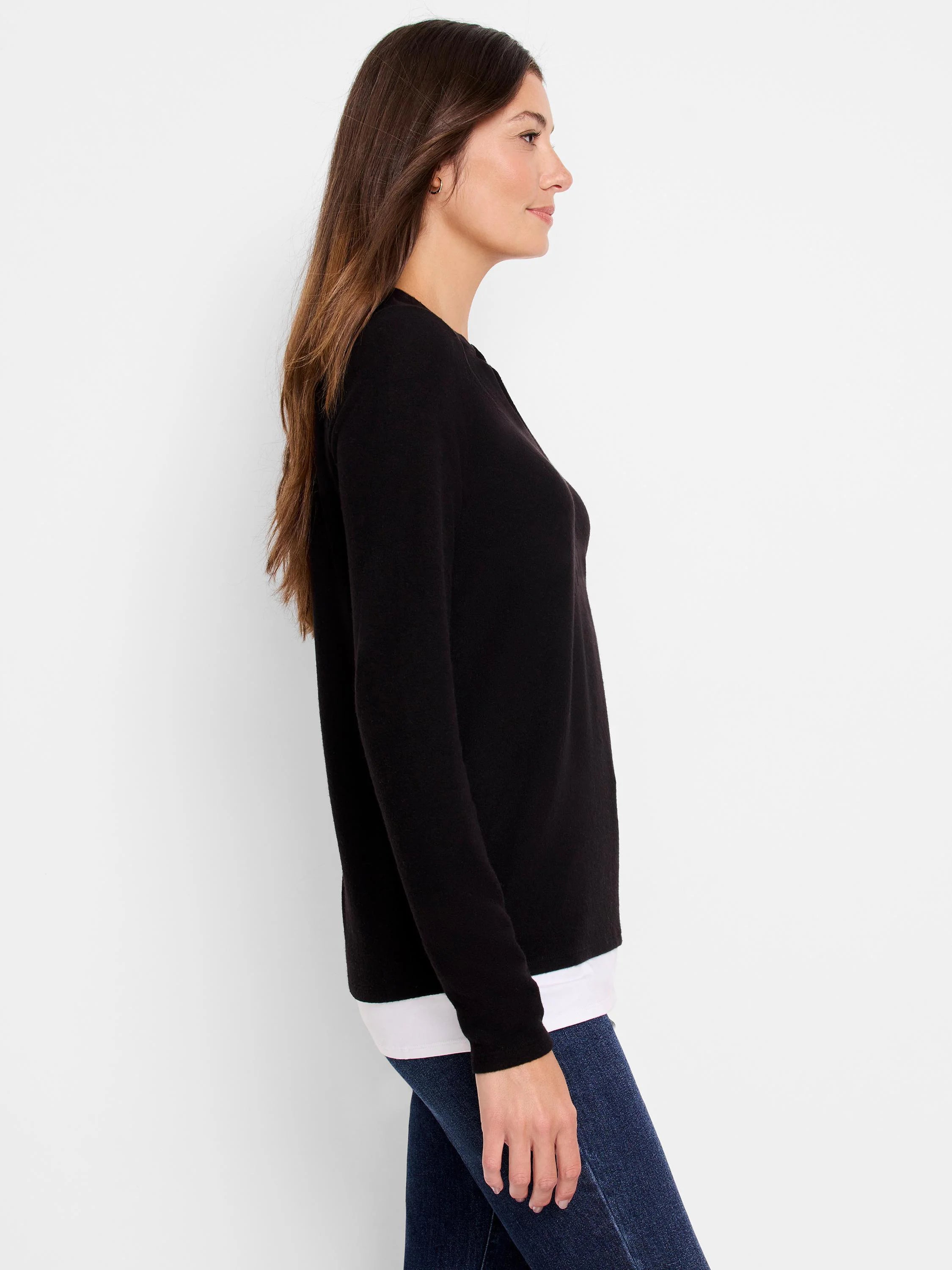 Black long-sleeved top, shown on model. Slight raglan sleeve.
