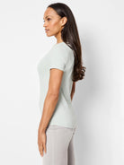 Pale green fitted short sleeve crew neck tee, worn by a model in profile.