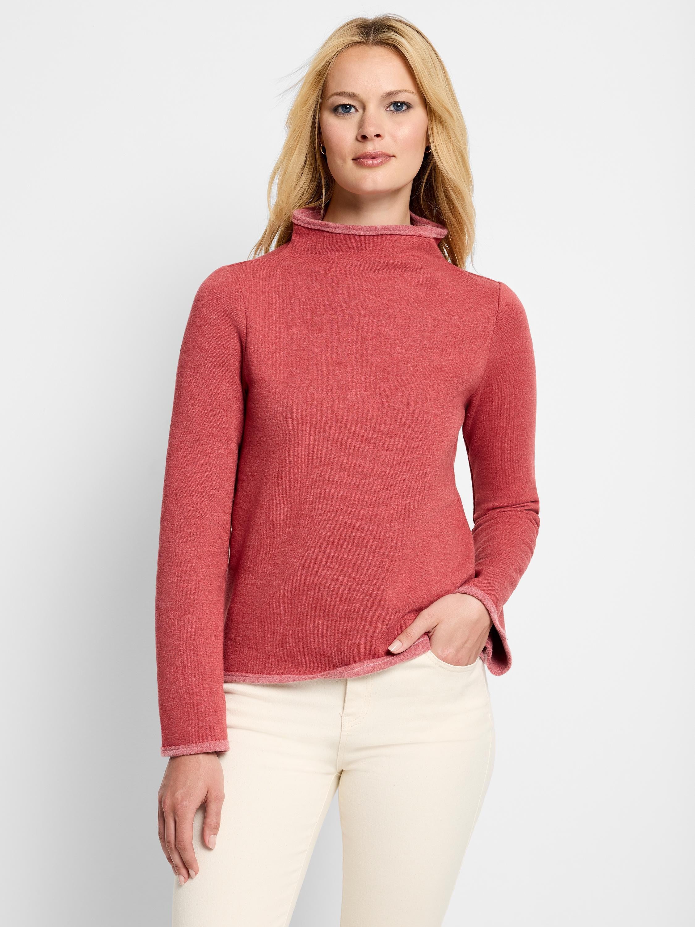 Reddish-pink long-sleeve mock neck top with darker pink trim. Slightly curved hem.