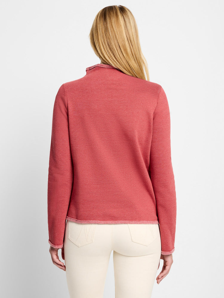 Dusty rose mock neck sweater, long sleeves, raw hem. Back view.