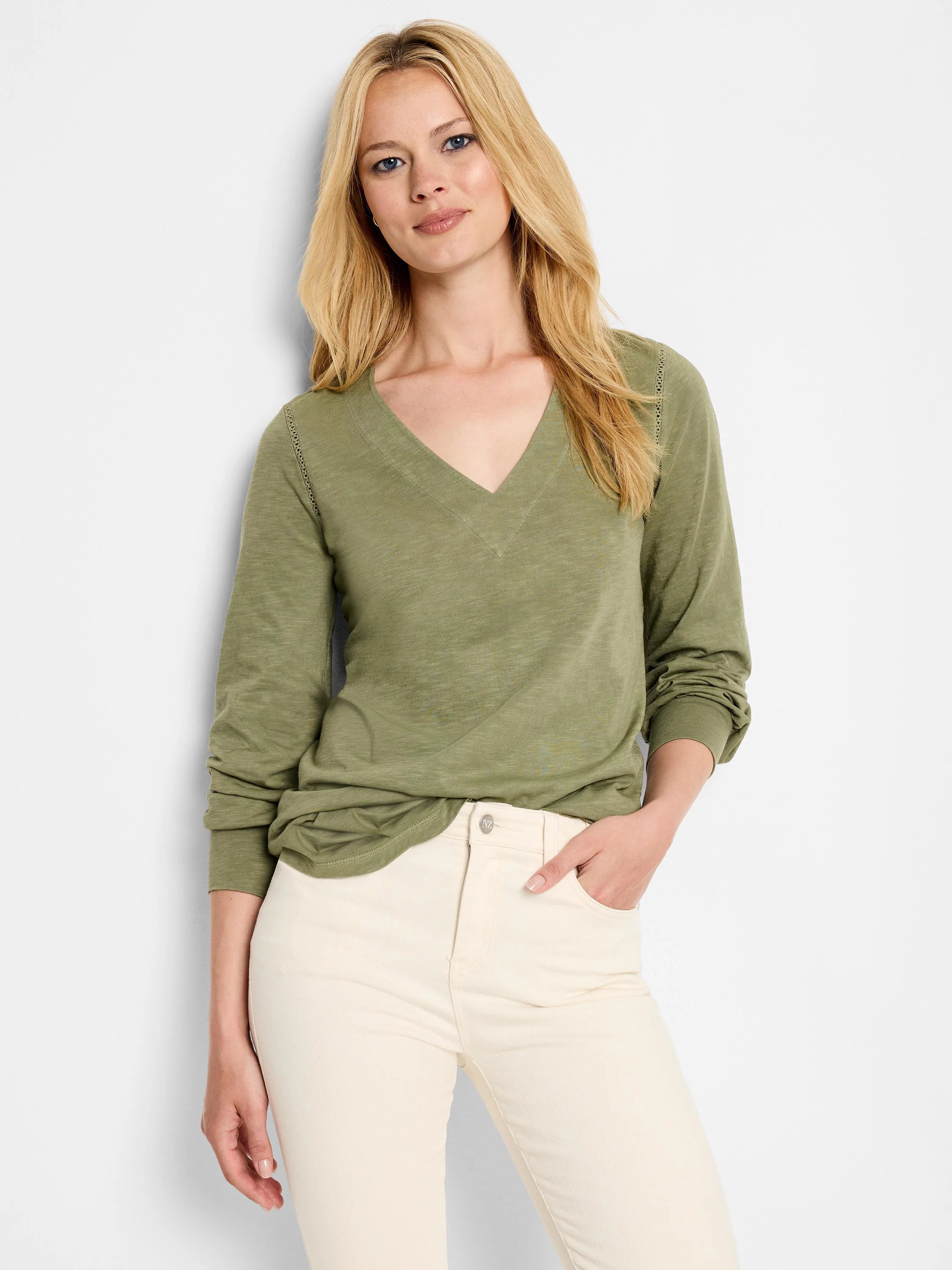 Olive green long-sleeve v-neck top with lace detailing at shoulder.