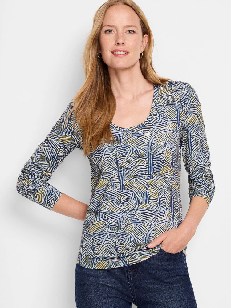 Long-sleeve scoop neck shirt; off-white background with blue, green, and beige sketched lines forming an abstract pattern.