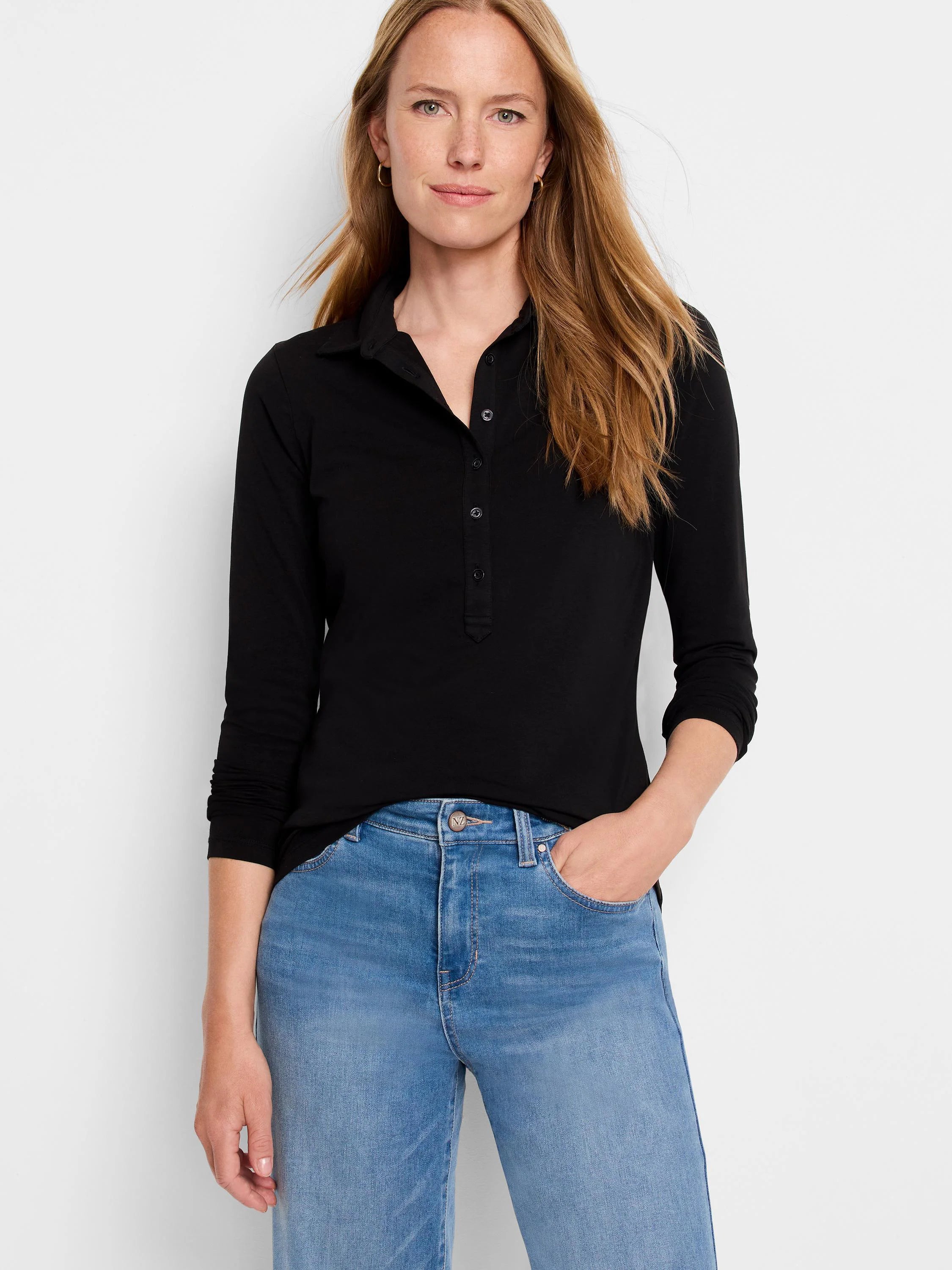 Black long-sleeve polo shirt with dark buttons. Model wears light wash jeans.