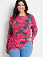 Long-sleeve shirttail tee with fuchsia and charcoal gray floral print.