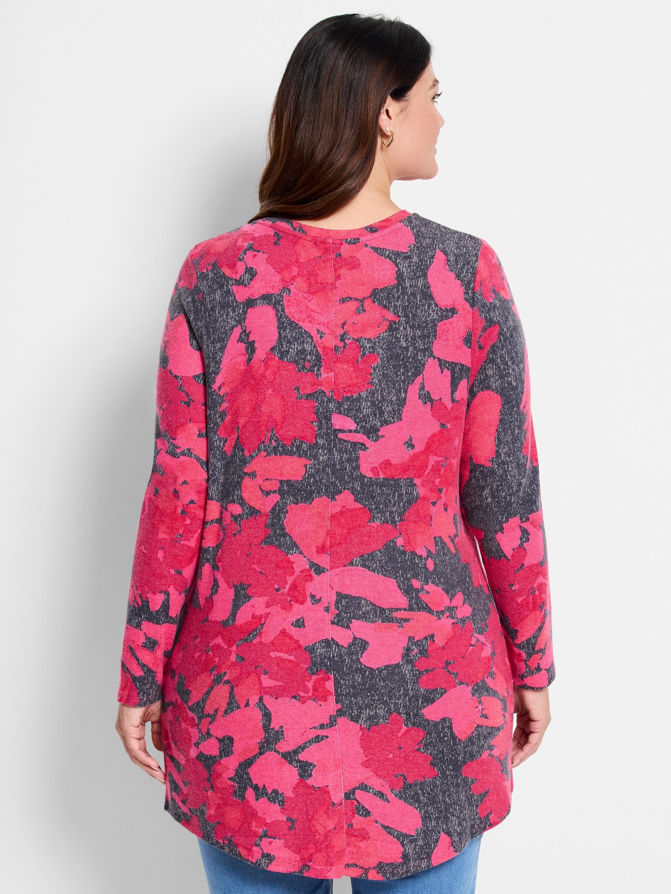 Long-sleeve shirttail tee with pink and gray floral print on a charcoal gray background.  Long, relaxed fit.