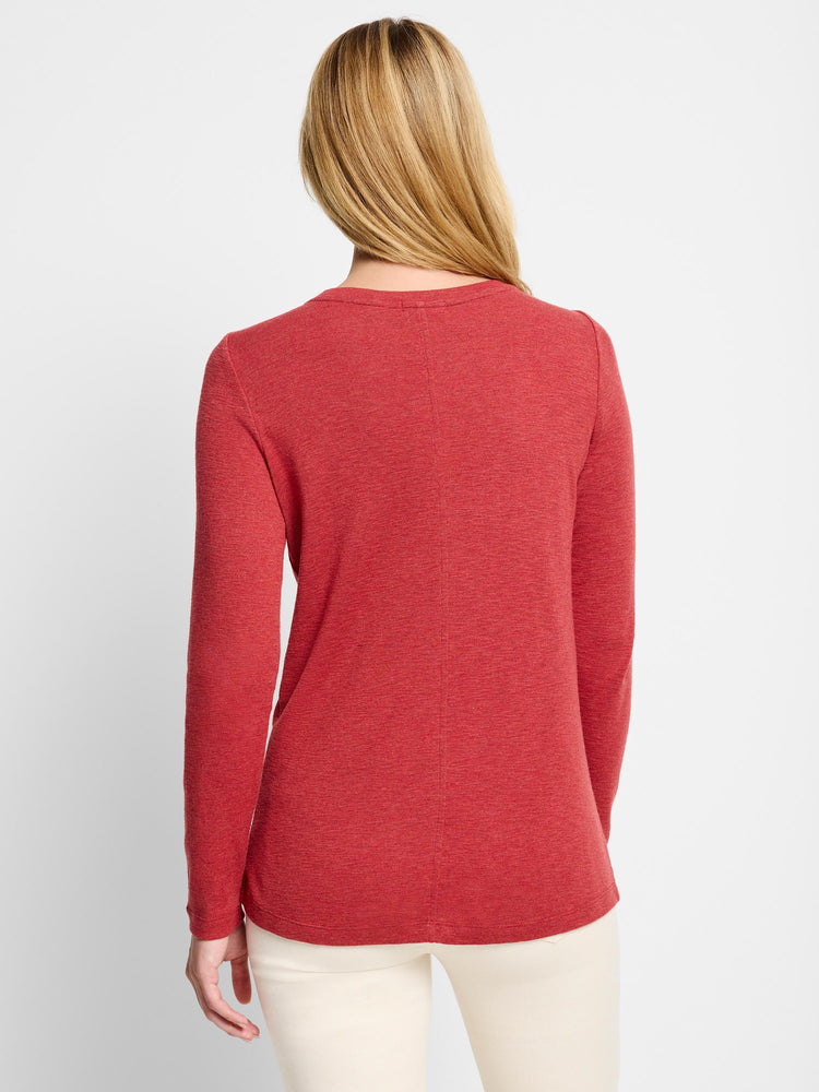 Red long-sleeve shirt, boat neck, textured fabric. Back view.