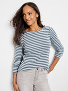 Gray and light blue striped, 3/4 sleeve boat neck shirt.