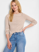 Beige and white horizontal striped long-sleeve shirt.  Crew neck.