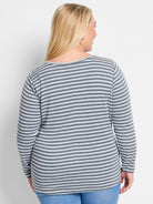 Gray and light blue horizontally striped long-sleeve boat neck shirt.  Back view.