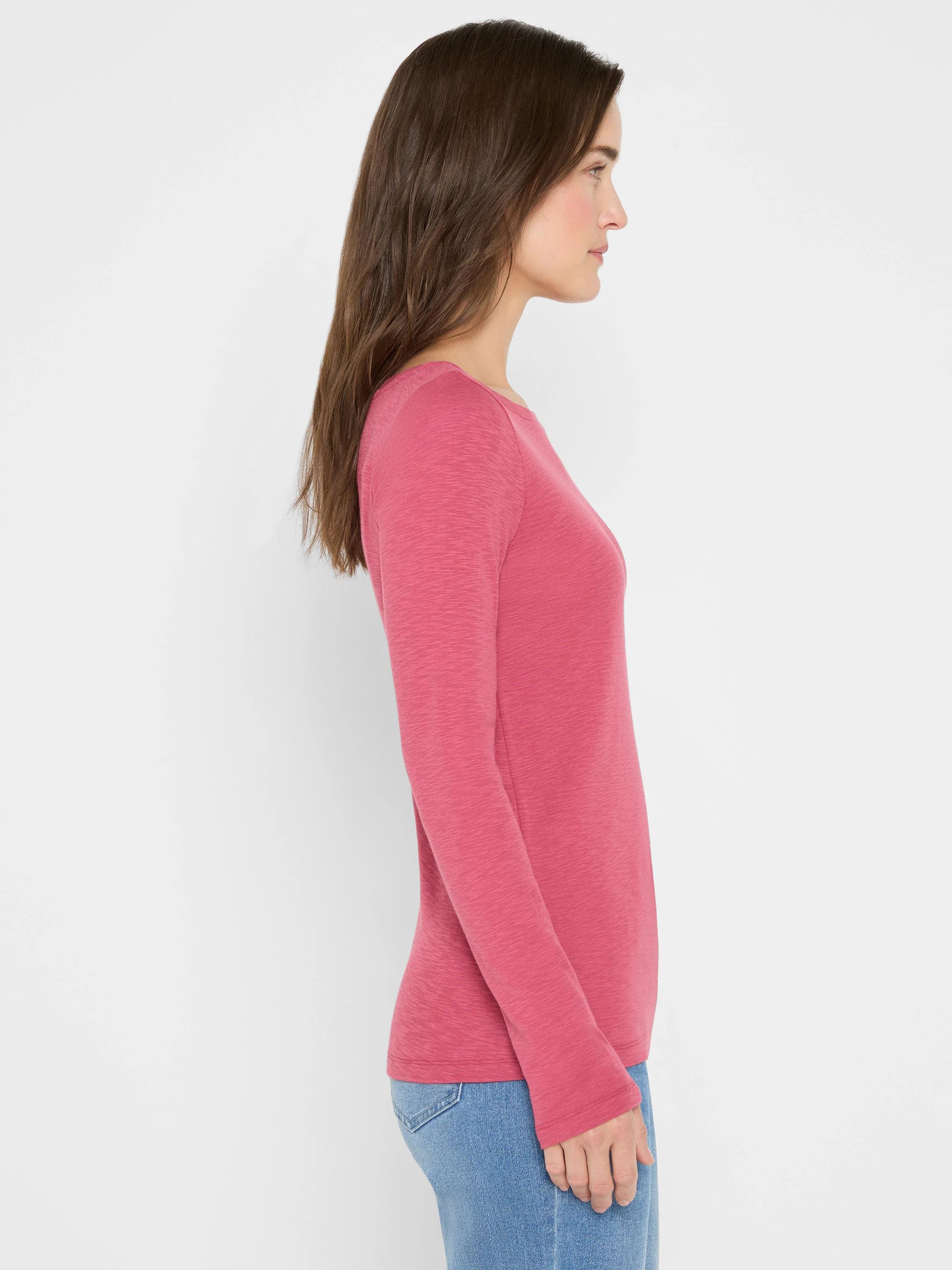 Rose-colored long-sleeve shirt; boat neckline; textured fabric.
