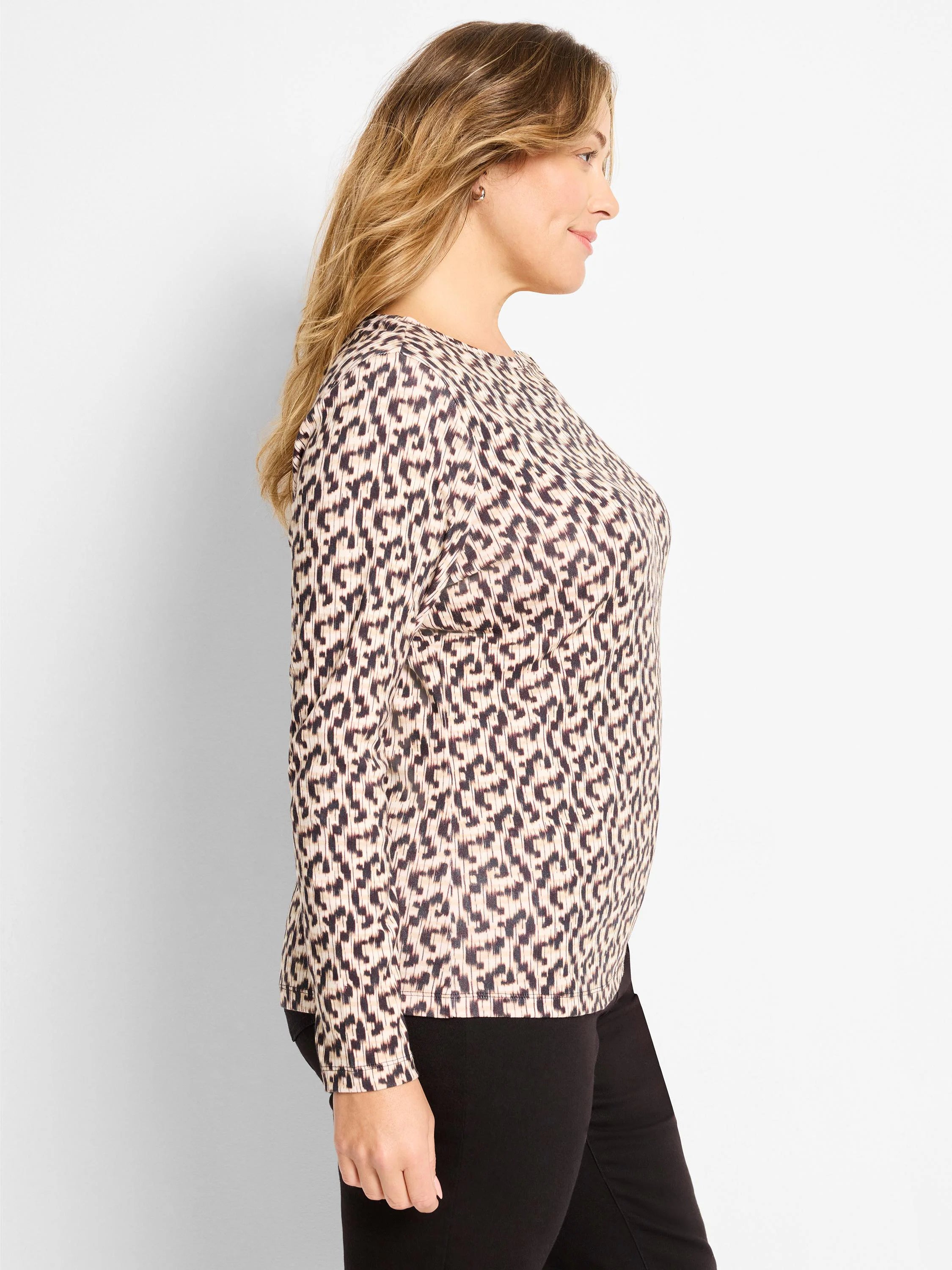 Light tan long sleeve boat neck tee with a dark, stylized linear print.