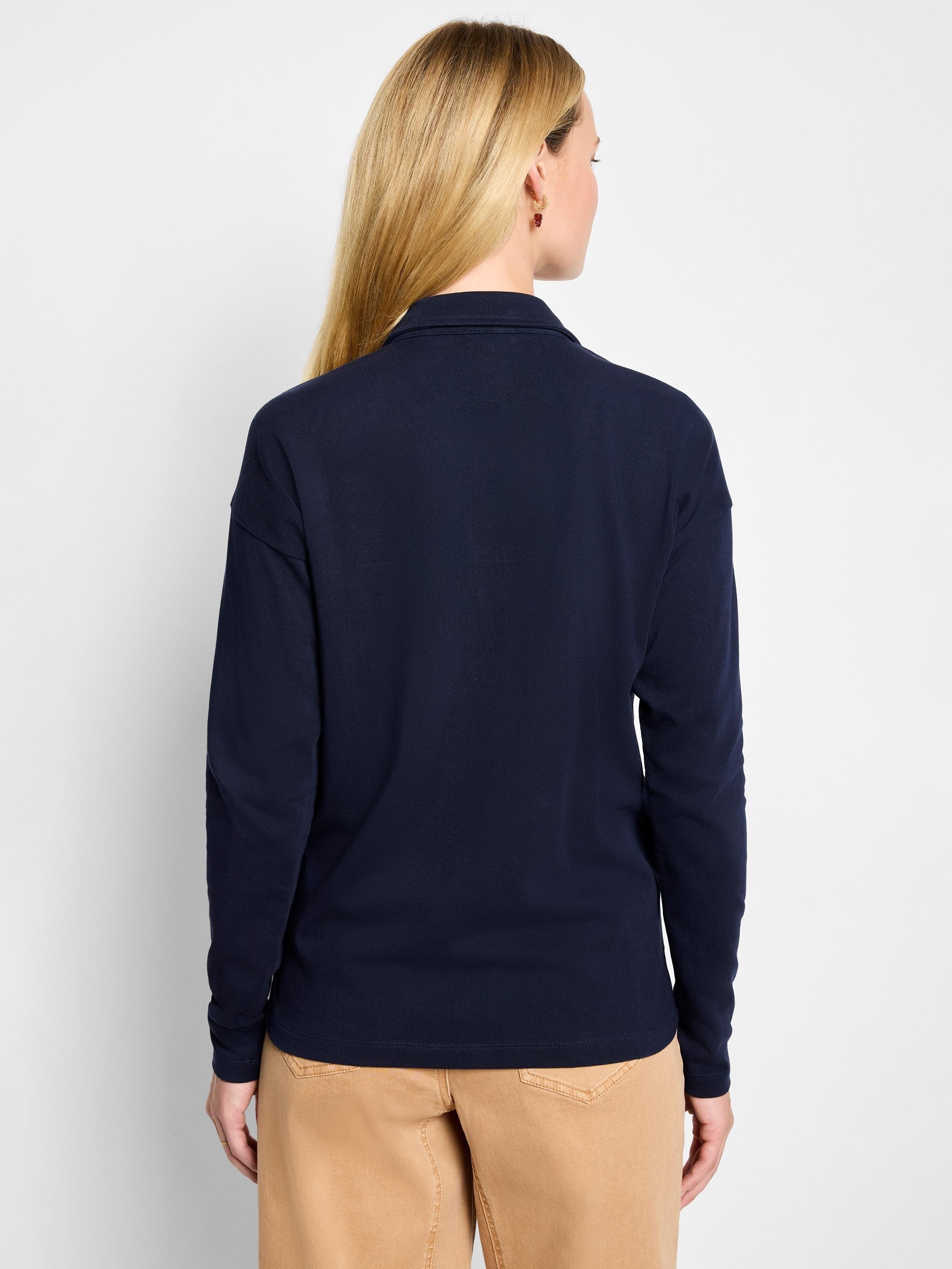 Navy blue long-sleeve polo top, shown from the back on a model.