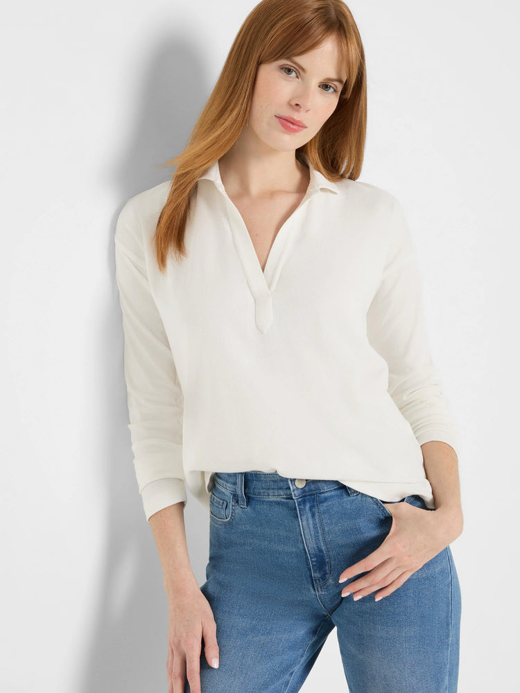 Cream long-sleeve ribbed polo top with collar and open V-neck.