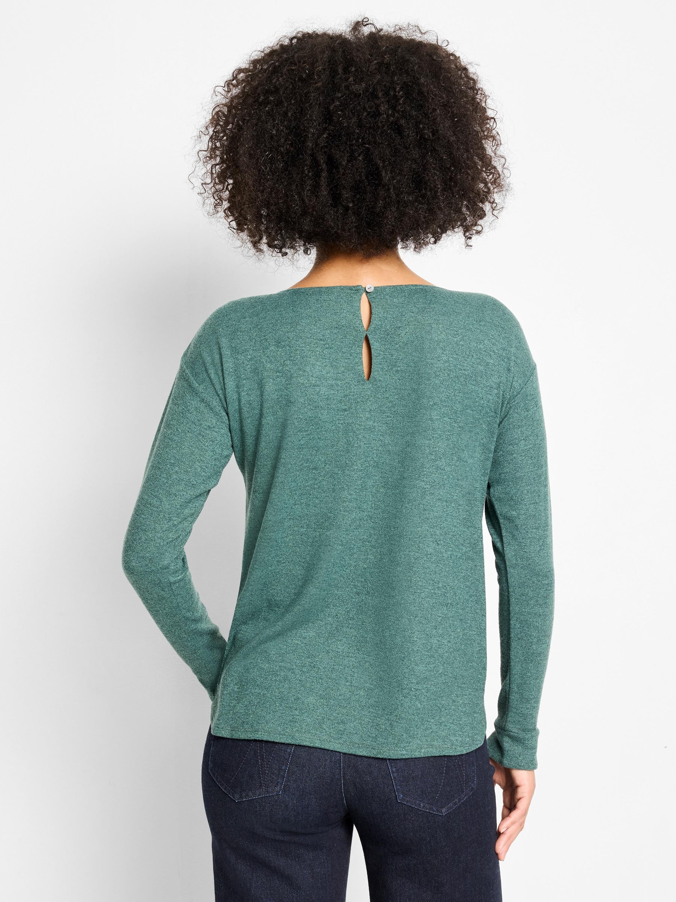 Back view of a person in a heathered teal long-sleeve top with a keyhole button closure at the nape.