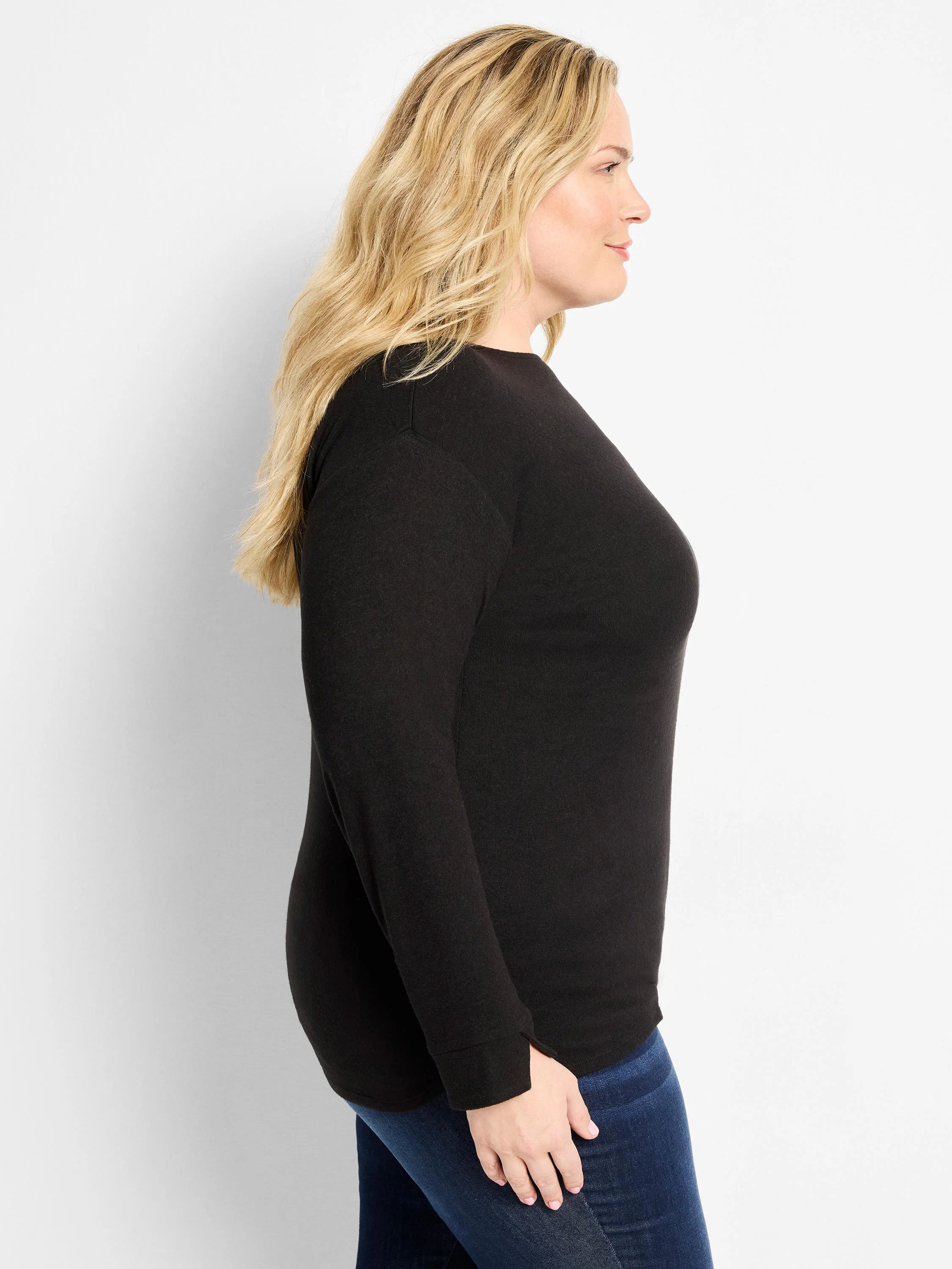 Black long-sleeved top with a round neck, slightly dropped shoulders, and a small slit detail on the cuffs.