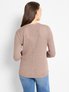 Here's alt text for the image, under 125 characters:
"Mauve long-sleeve henley shirt, shown from the back.  The shirt is...
