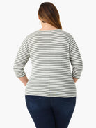 Back view of a white and sage green striped 3/4 sleeve boat neck tee with a center back seam.