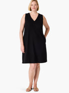Black sleeveless V-neck dress, knee-length, with pockets.