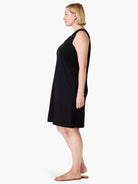 Black sleeveless V-neck dress, knee-length, shown on a model.