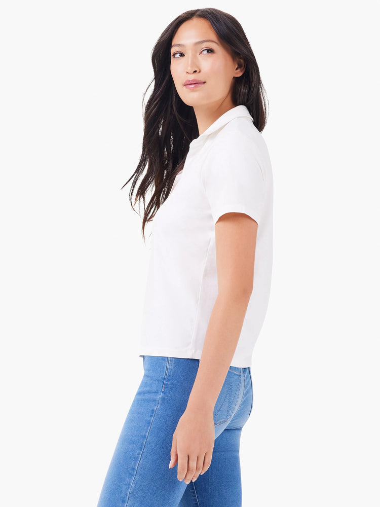 White short-sleeve polo shirt with a collared neckline. Shown on a model.