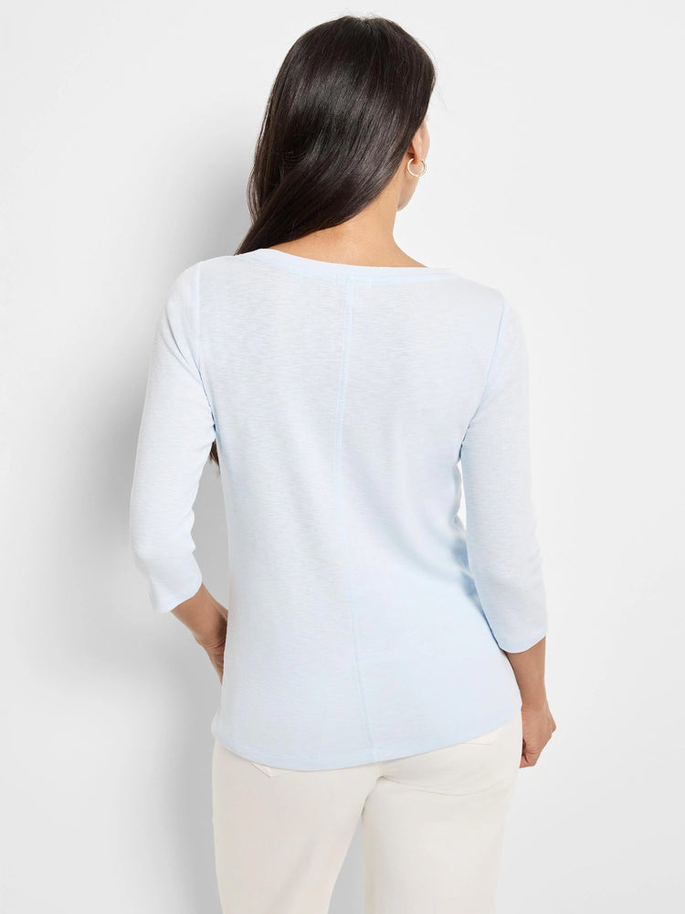 Pale blue 3/4 sleeve tee, back view on model. Features wide neckline and visible center back seam.