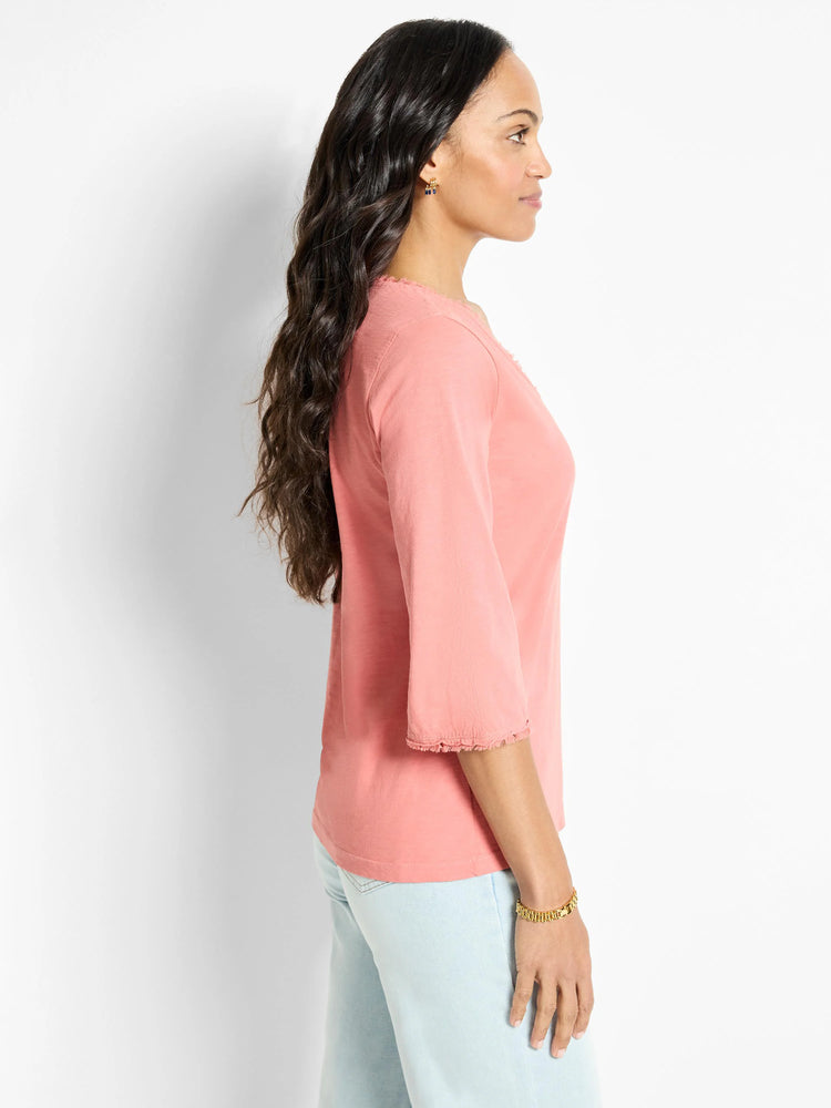 Salmon-pink, 3/4 sleeve t-shirt. Sleeves have frayed edges.