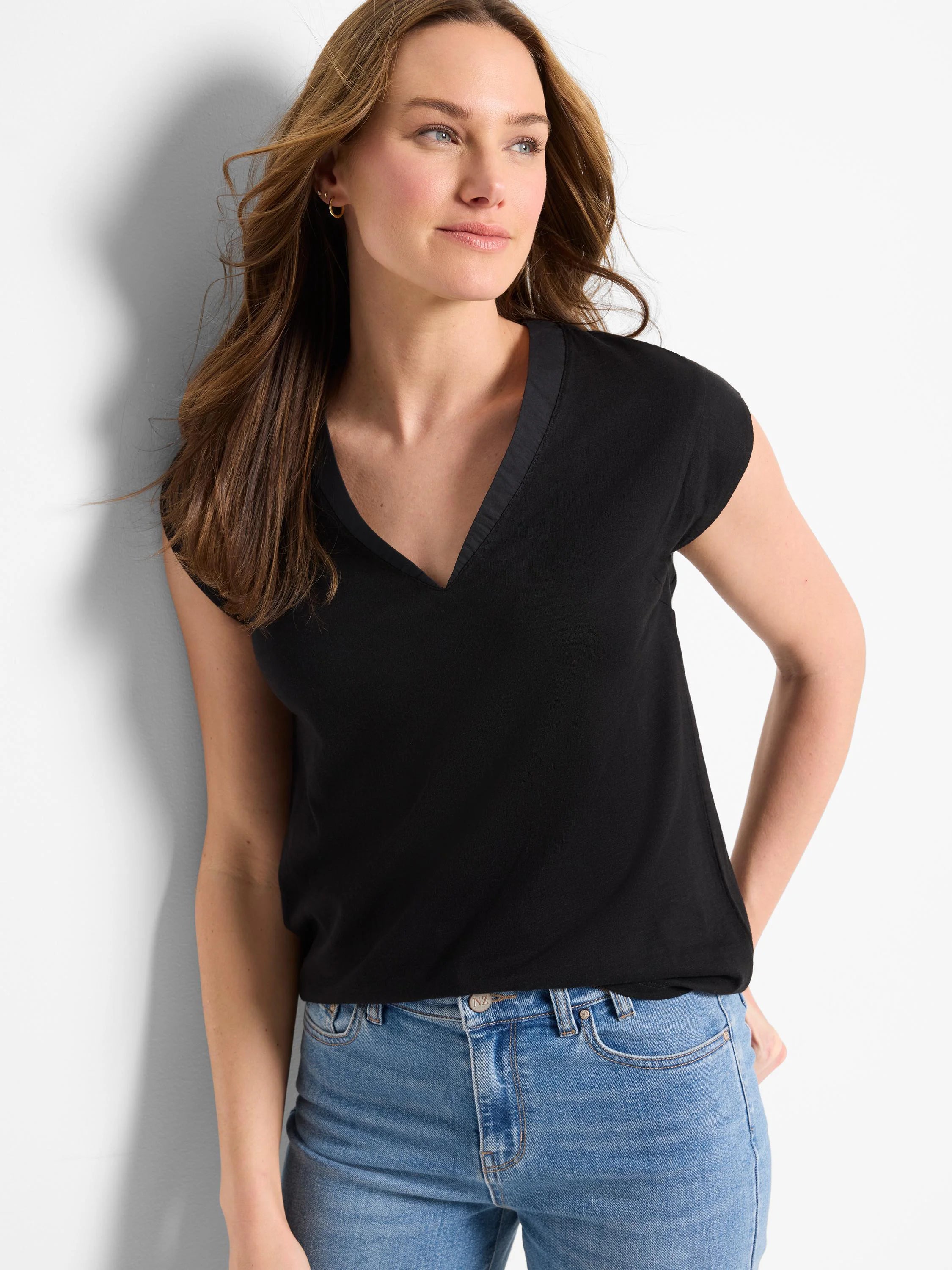Black knit V-neck tank top with cap sleeves. Features a smooth, subtly contrasting trim along the V-neckline.