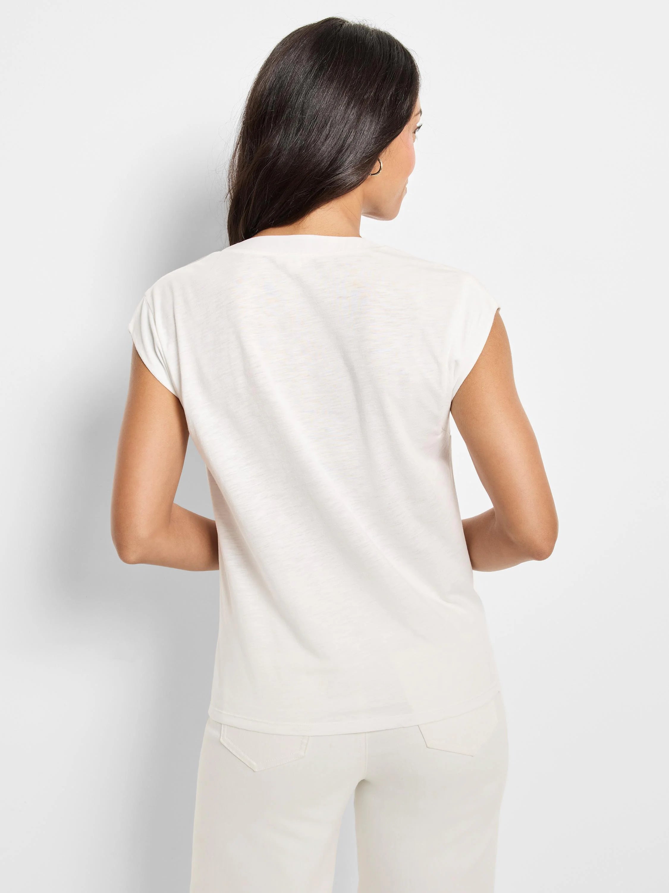 Light cream cap-sleeve top on model, back view. Round neck and subtle slub texture.