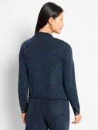 Dark indigo jacket, subtle vertical ribbing. Collar, long sleeves, and prominent back panel seaming details.