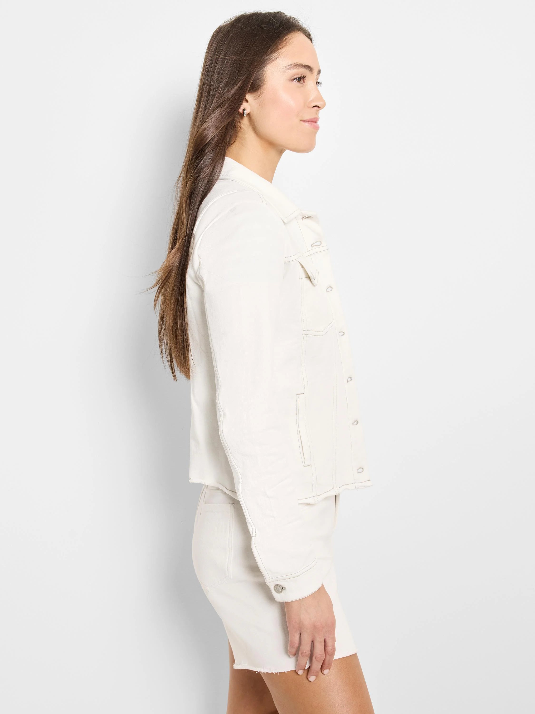 Off-white denim look jacket with button front, collar, chest flap pockets, and visible contrast stitching.