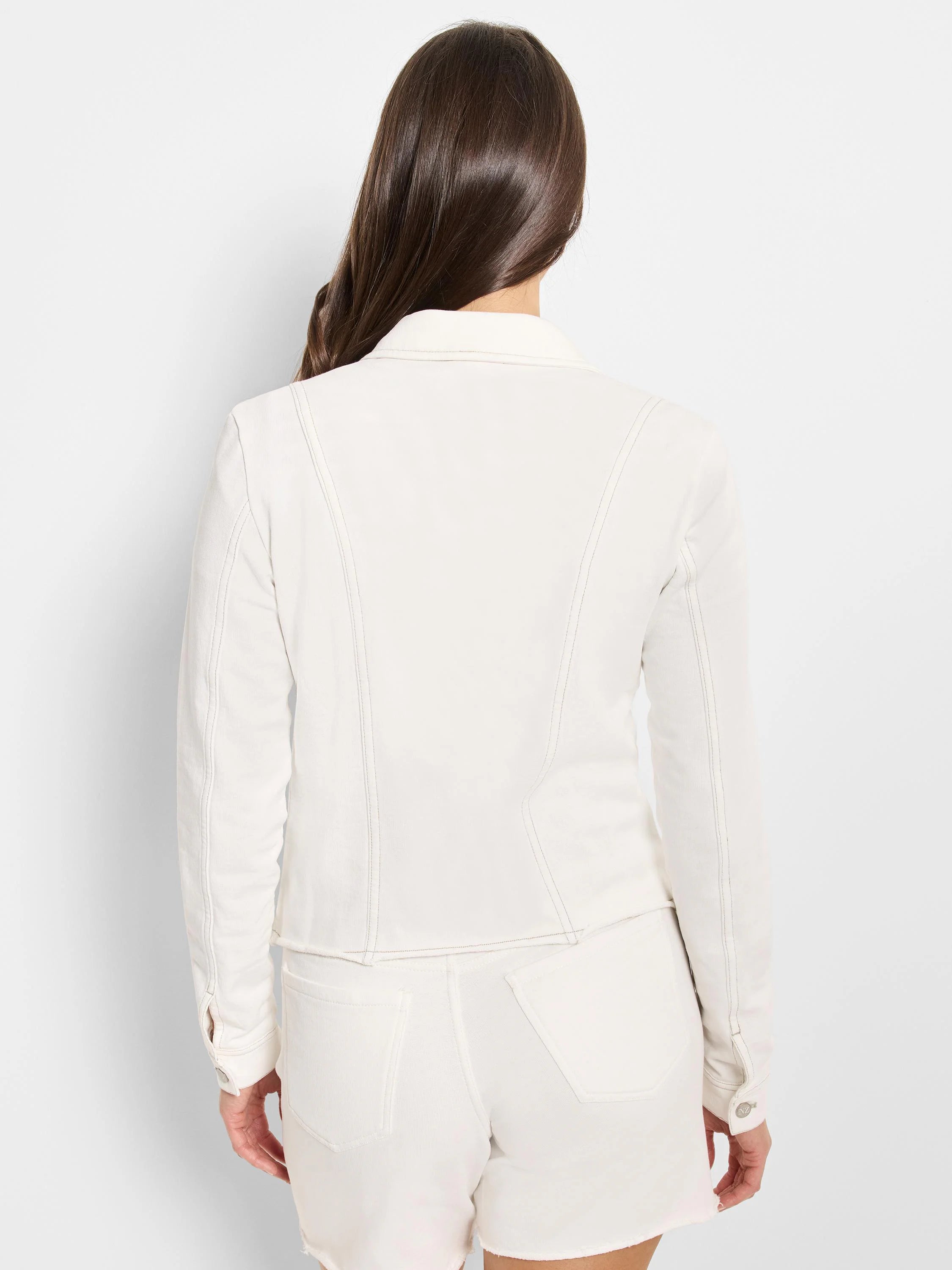 Back view of an off-white jacket with a collar, tan contrast stitching details, and buttoned cuffs.
