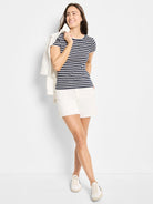 Off-white denim shorts on a model.