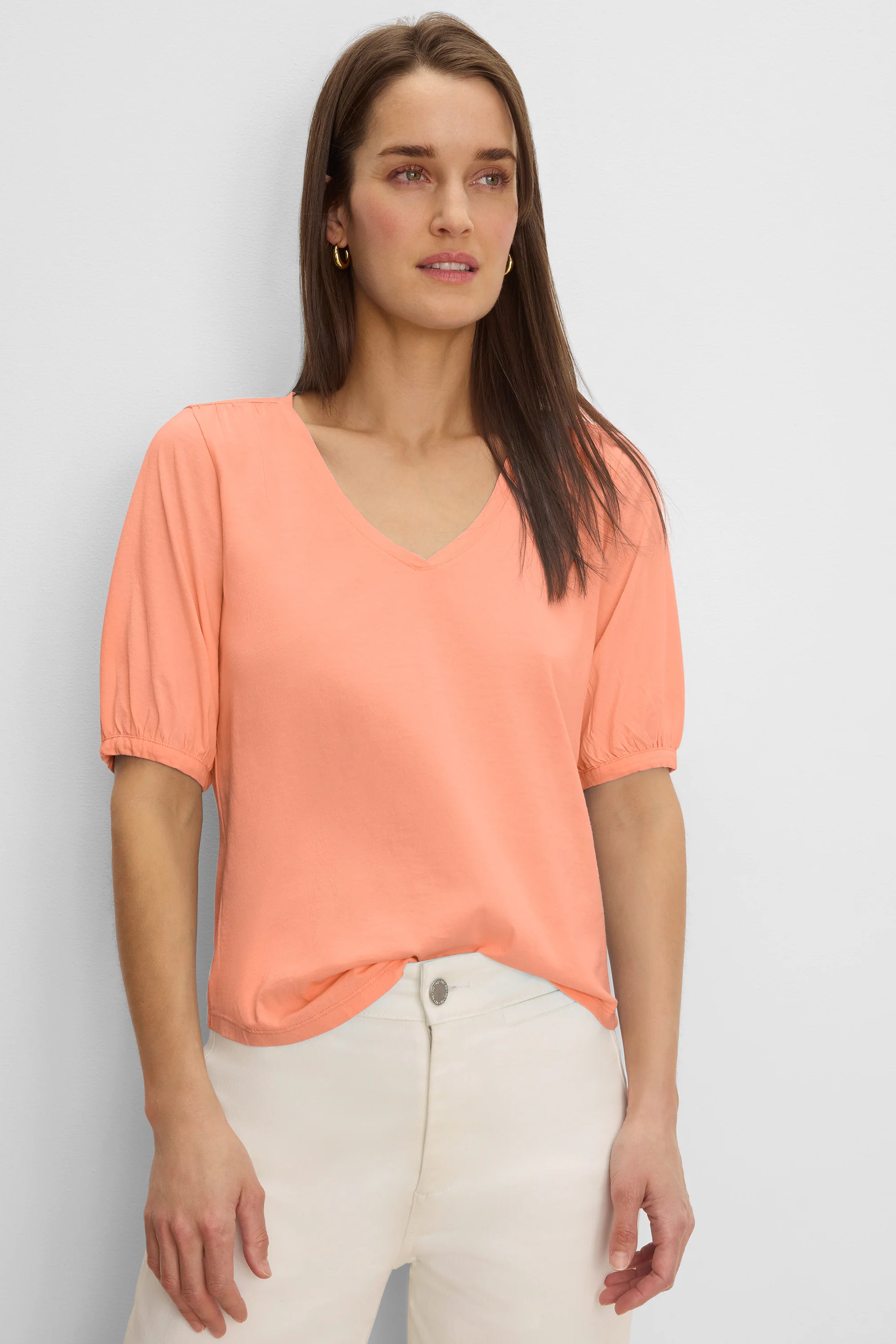 Peach V-neck tee with gathered elbow sleeves.
