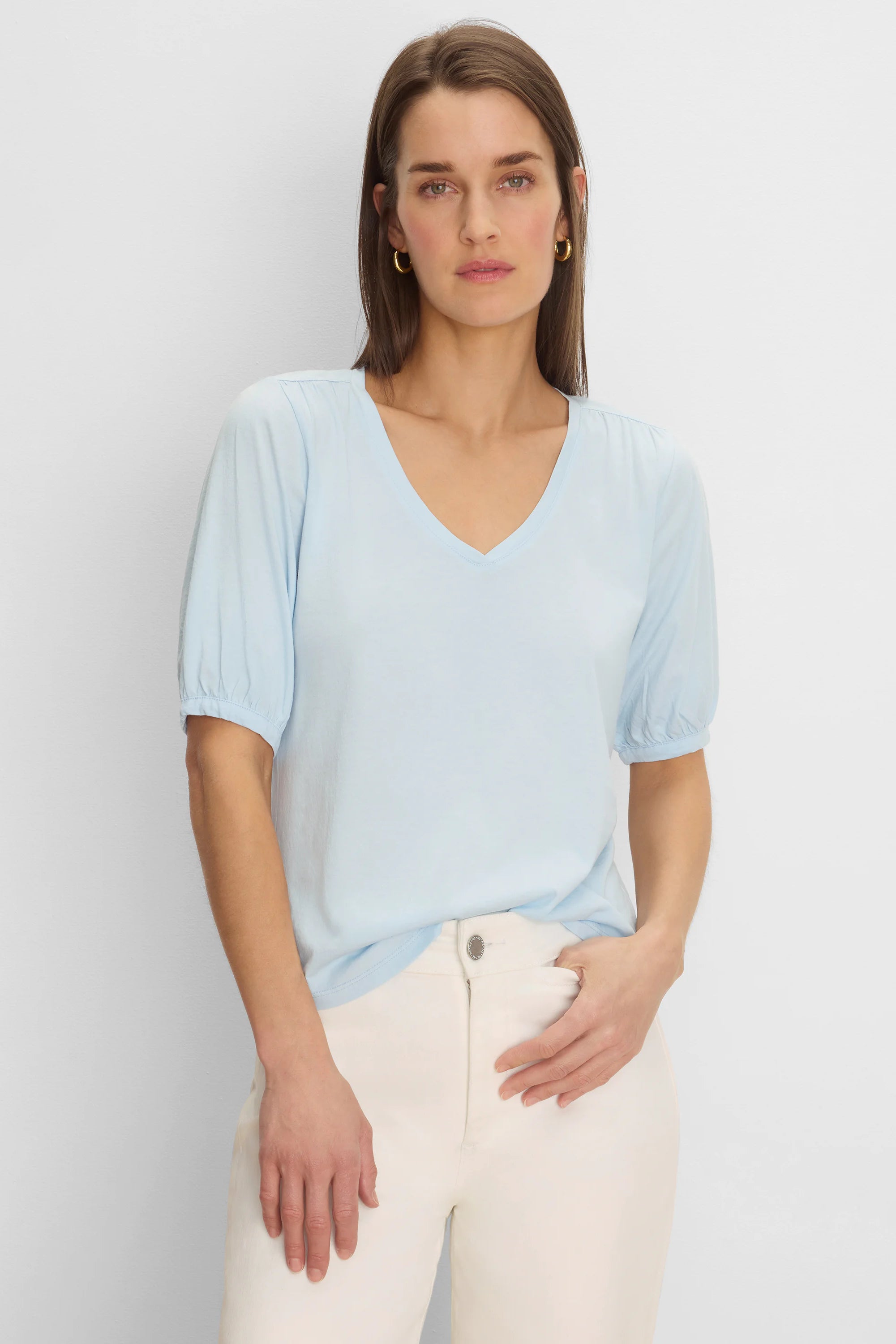 Light blue V-neck tee with elbow-length sleeves, gathered at shoulders and cuffs.