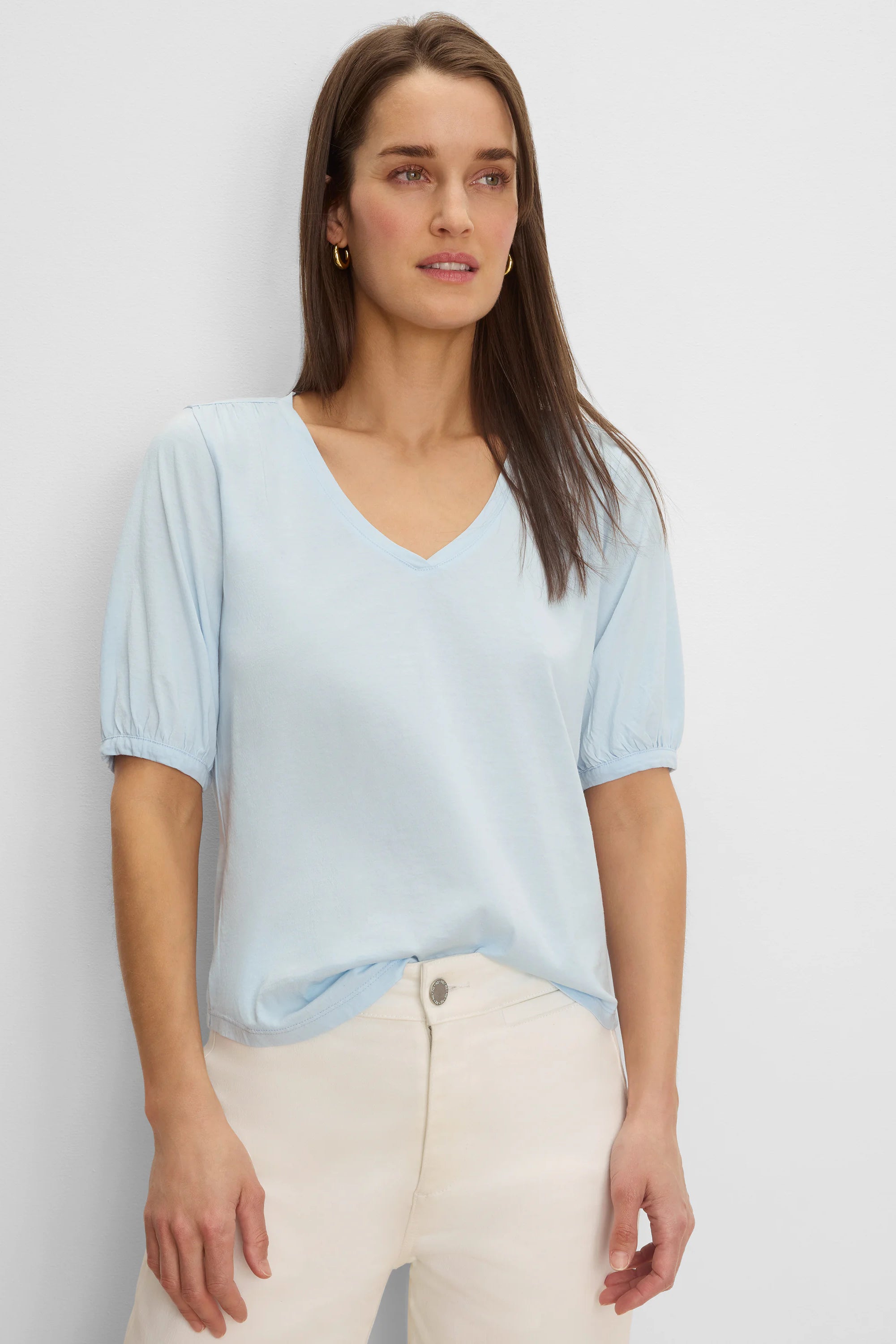 Light blue V-neck tee with elbow-length gathered sleeves.