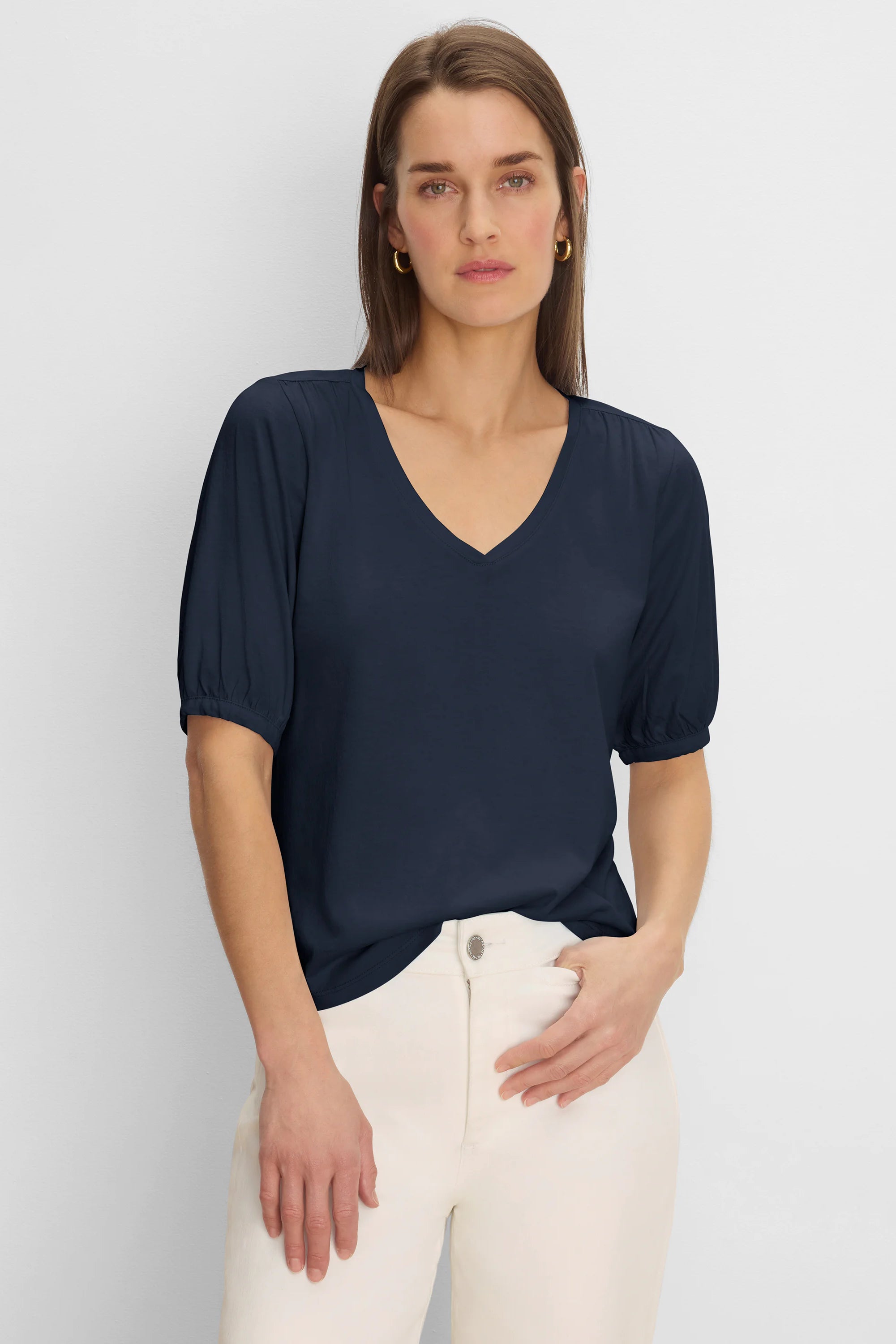 Navy V-neck tee with gathered elbow sleeves.