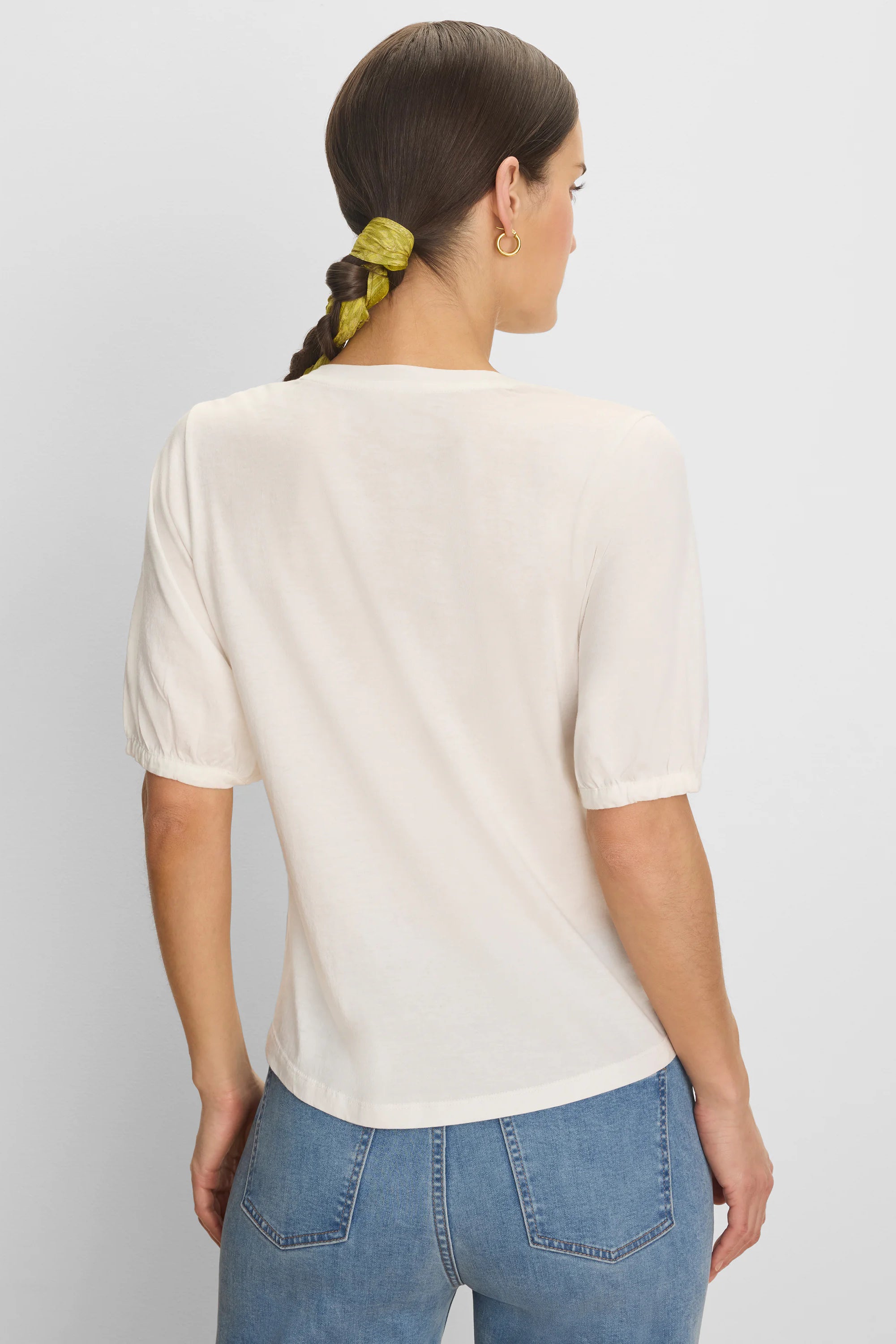 Cream elbow-sleeve tee with gathered cuffs, shown from the back.