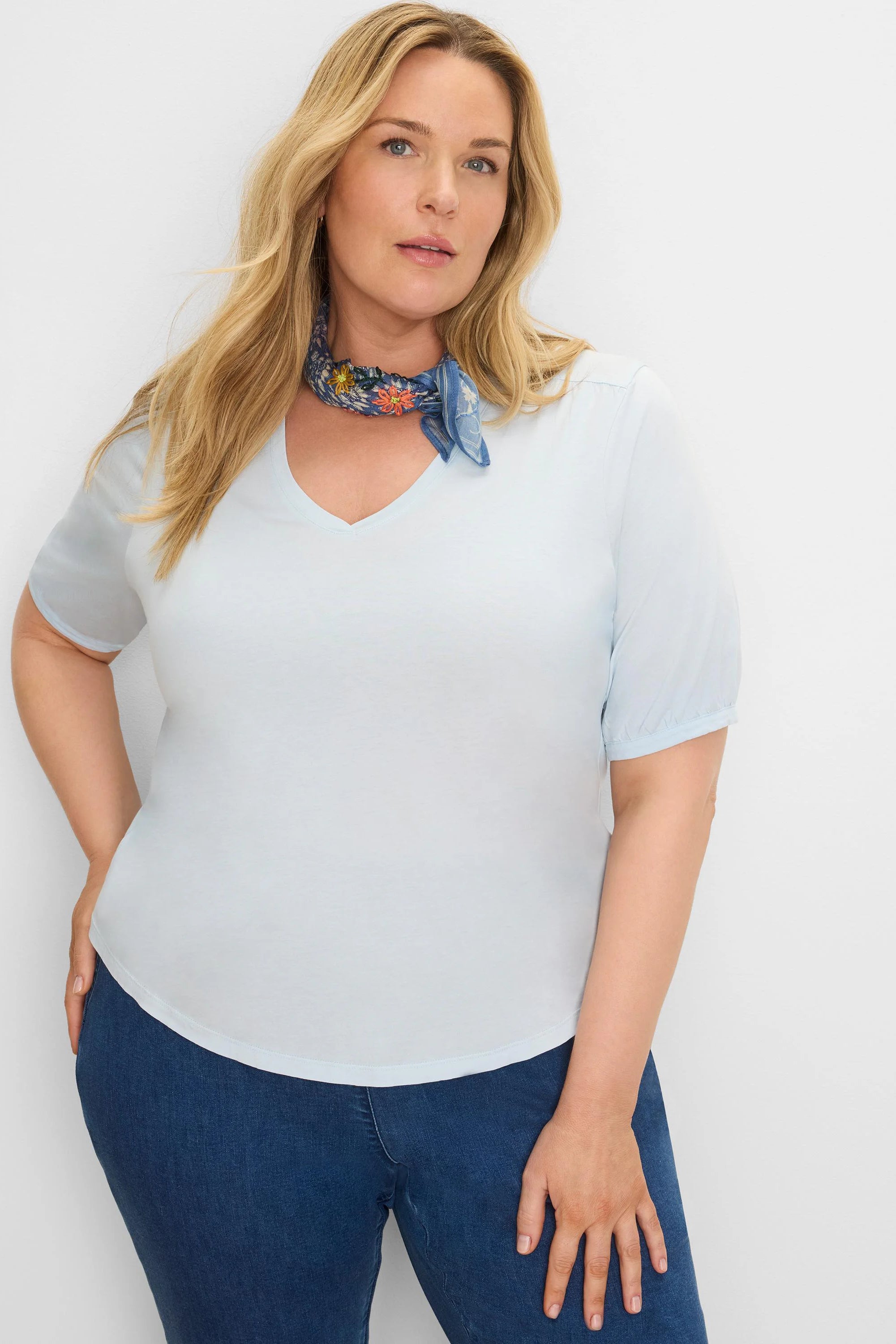 Light blue V-neck elbow sleeve tee with gathered cuffs.