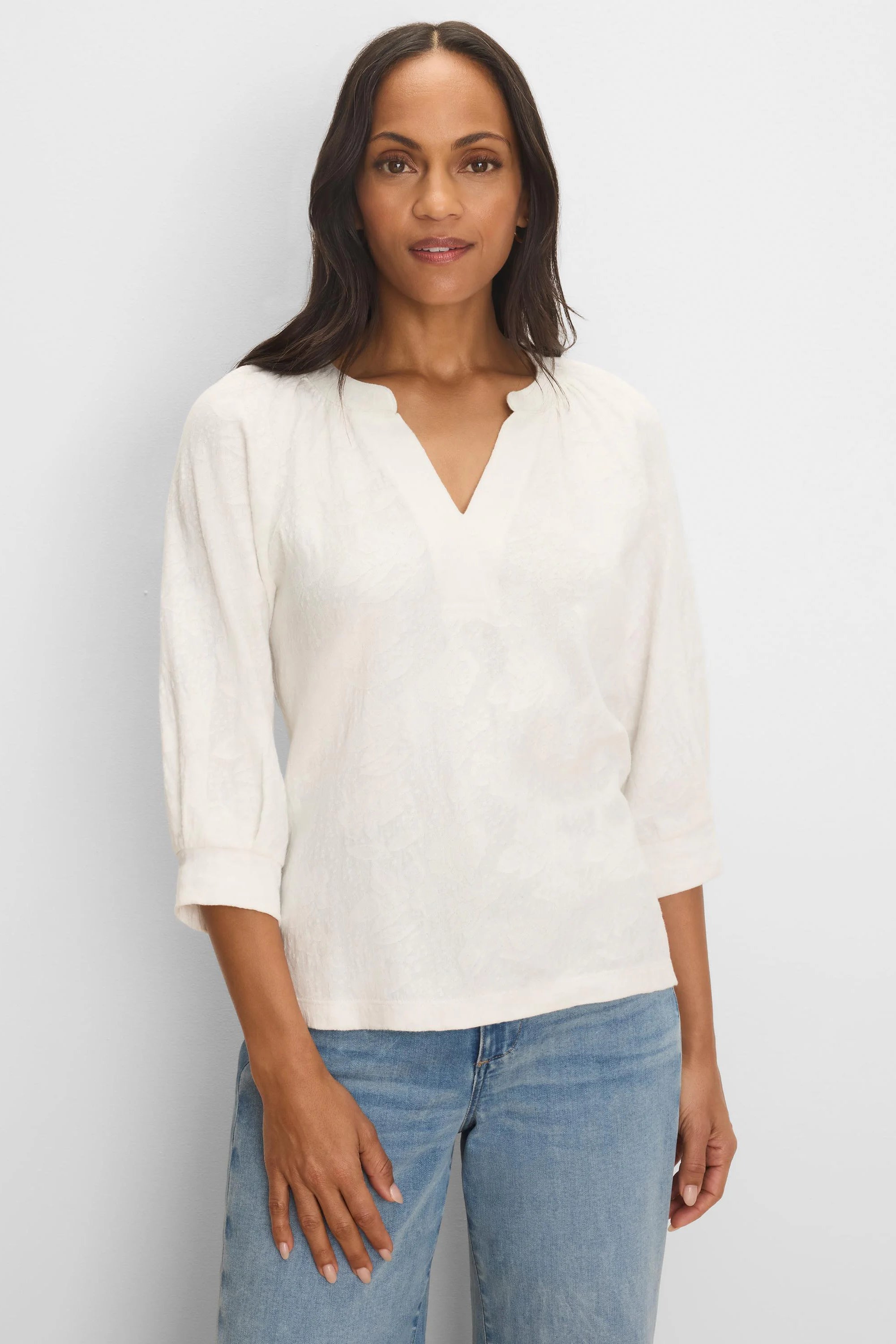 Cream lace knit top with a split V-neck, 3/4 sleeves, and a subtle, textured pattern.