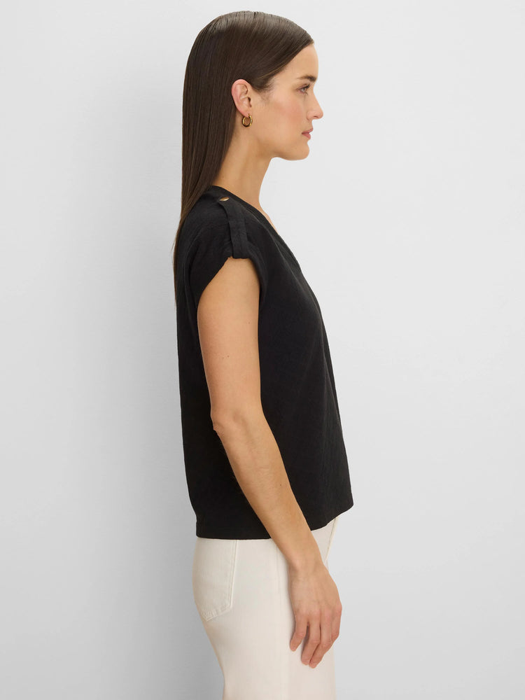 Black textured knit tee, relaxed fit. Cap sleeves with gold button shoulder tabs.