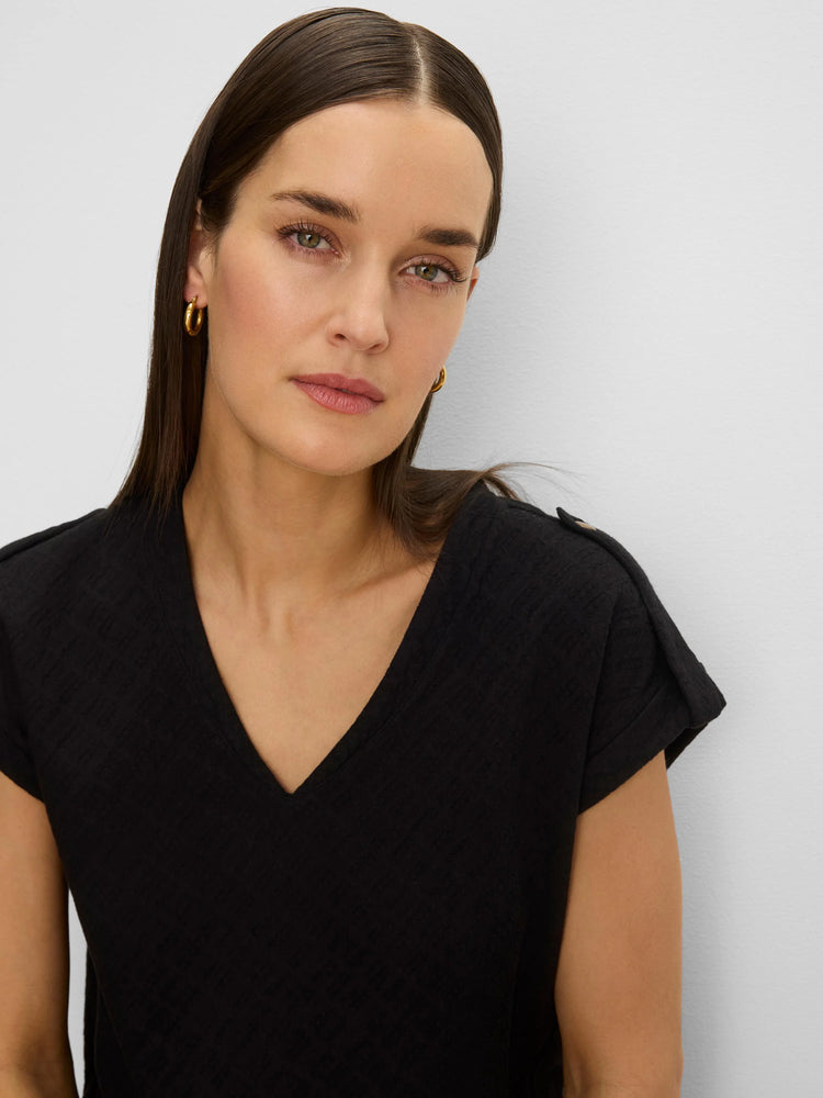 Black lace knit tee with V-neck and rolled cap sleeves.
